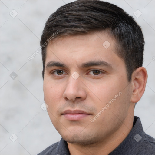 Neutral white young-adult male with short  black hair and brown eyes