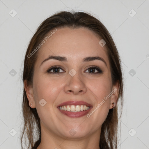 Joyful white young-adult female with long  brown hair and grey eyes