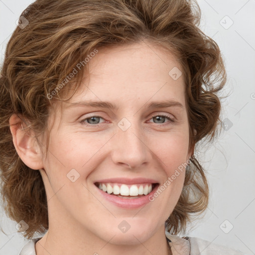 Joyful white young-adult female with medium  brown hair and green eyes