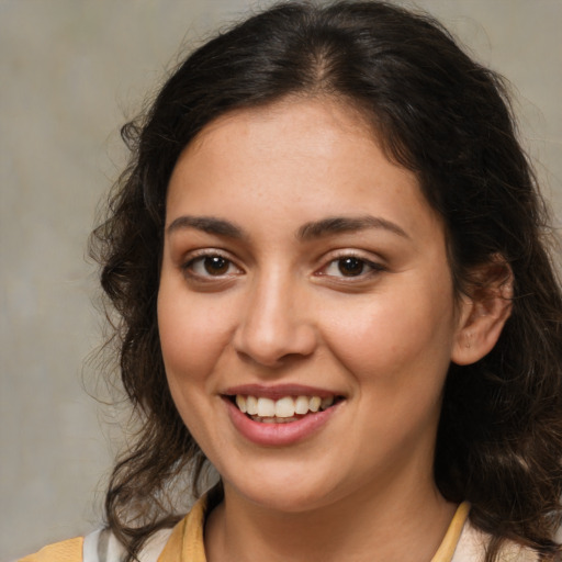 Joyful white young-adult female with medium  brown hair and brown eyes