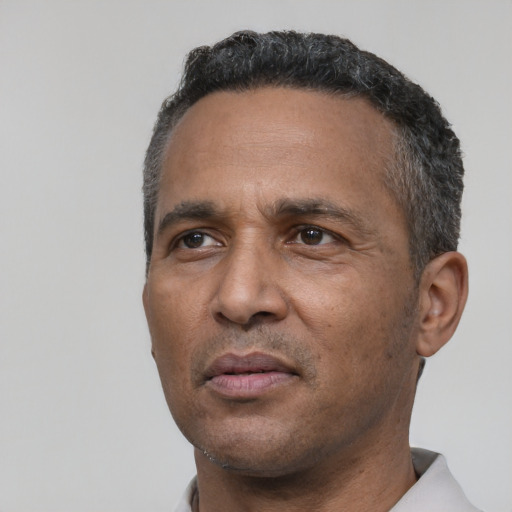 Neutral latino adult male with short  black hair and brown eyes