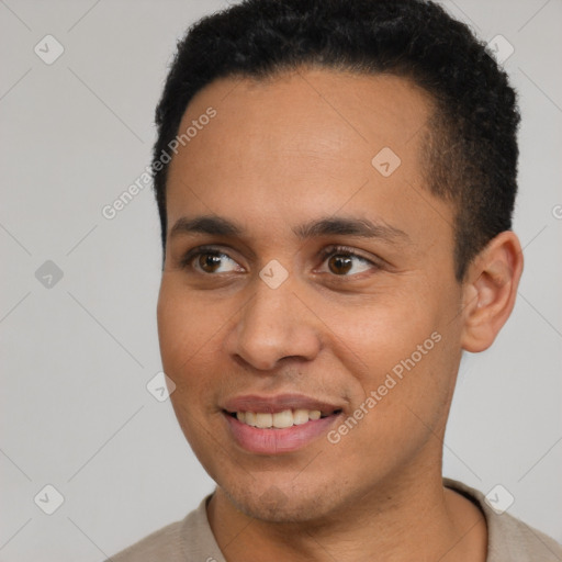 Joyful latino young-adult male with short  brown hair and brown eyes