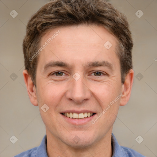 Joyful white adult male with short  brown hair and grey eyes