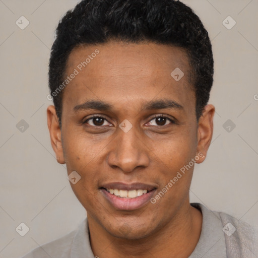Joyful black young-adult male with short  black hair and brown eyes