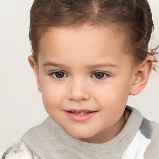 Joyful white child male with short  brown hair and brown eyes