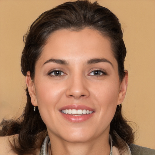 Joyful white young-adult female with medium  brown hair and brown eyes