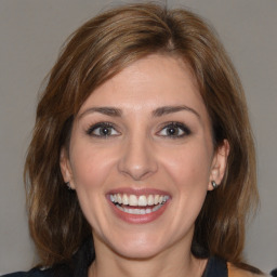 Joyful white young-adult female with medium  brown hair and brown eyes