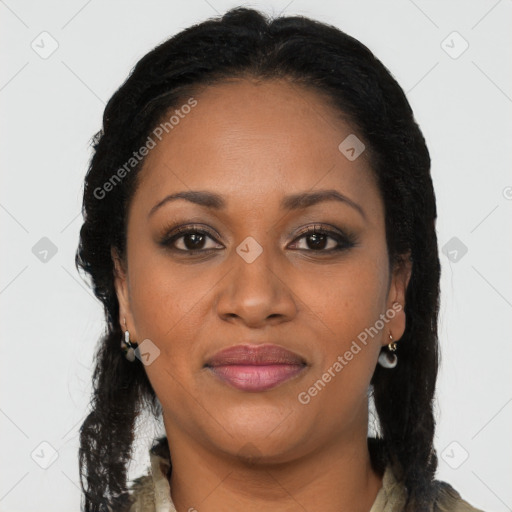 Joyful black young-adult female with long  brown hair and brown eyes