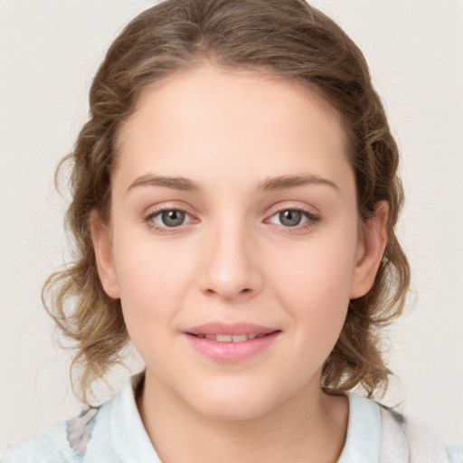 Joyful white young-adult female with medium  brown hair and green eyes