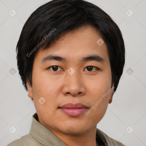 Joyful asian young-adult male with short  black hair and brown eyes