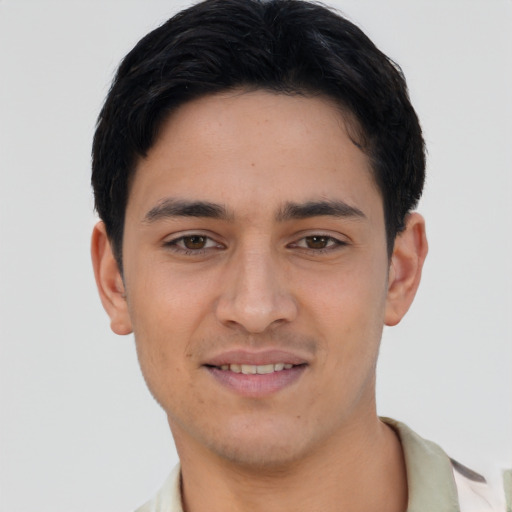 Joyful asian young-adult male with short  black hair and brown eyes