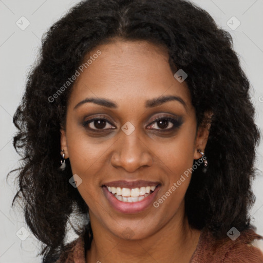 Joyful black young-adult female with long  brown hair and brown eyes