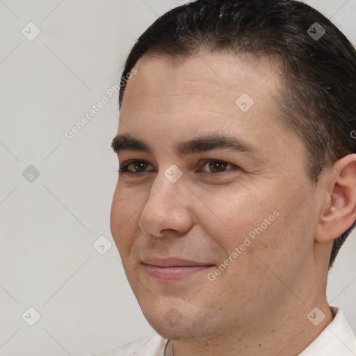 Joyful white young-adult male with short  brown hair and brown eyes