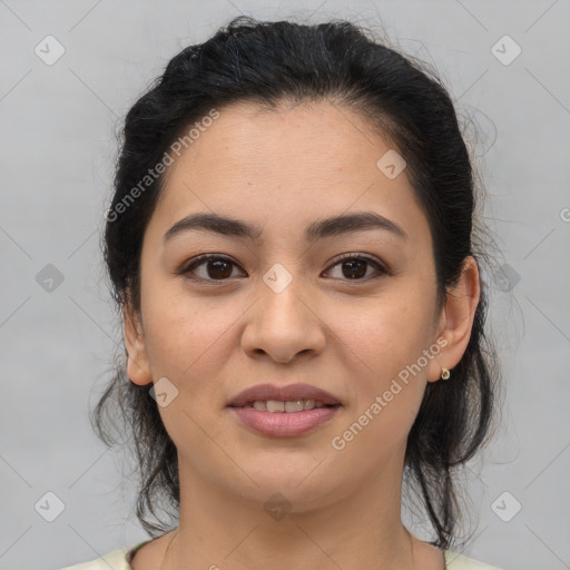 Joyful latino young-adult female with medium  brown hair and brown eyes