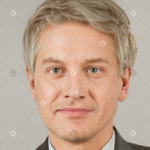 Neutral white adult male with short  brown hair and grey eyes