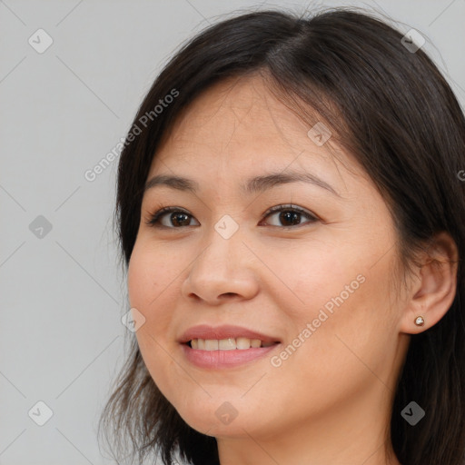 Joyful white young-adult female with long  brown hair and brown eyes