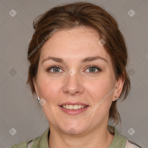 Joyful white adult female with medium  brown hair and grey eyes