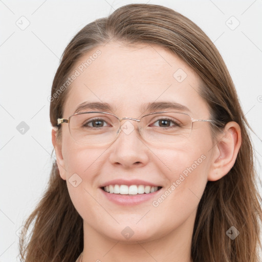 Joyful white young-adult female with long  brown hair and blue eyes