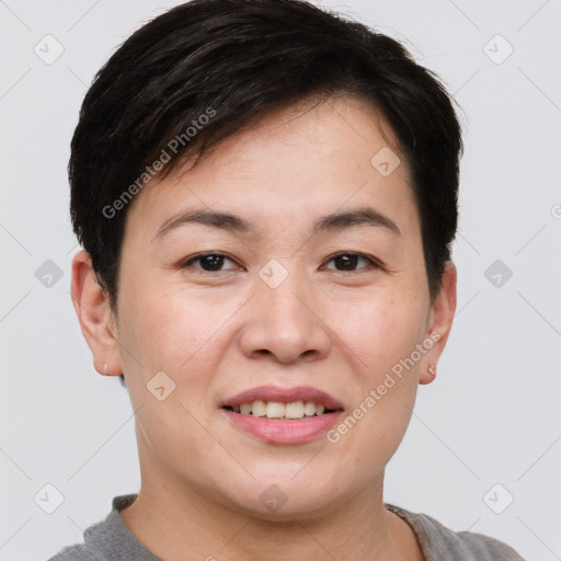 Joyful asian young-adult female with short  brown hair and brown eyes