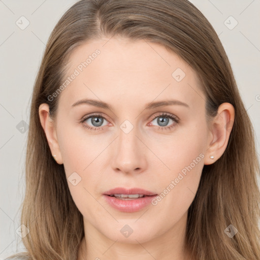 Joyful white young-adult female with long  brown hair and blue eyes