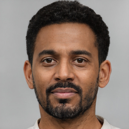 Neutral black young-adult male with short  black hair and brown eyes