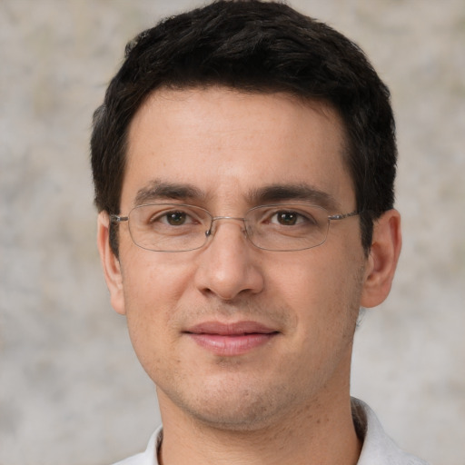 Joyful white adult male with short  brown hair and brown eyes