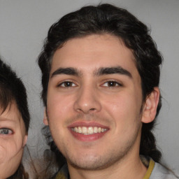 Joyful white young-adult male with medium  brown hair and brown eyes