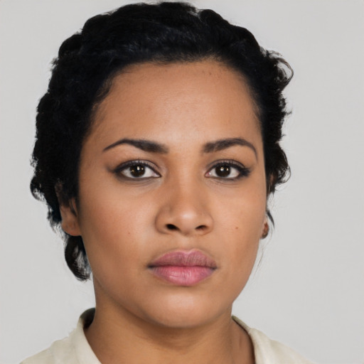 Neutral latino young-adult female with short  black hair and brown eyes
