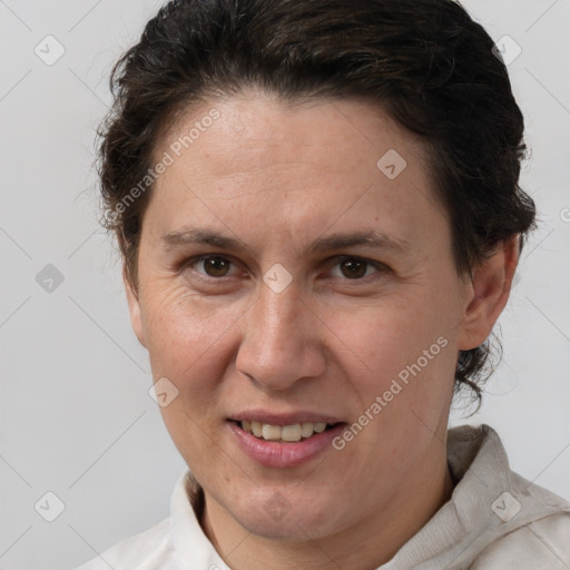 Joyful white adult female with short  brown hair and brown eyes