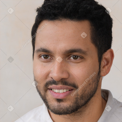 Joyful white young-adult male with short  black hair and brown eyes