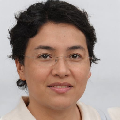 Joyful white adult female with short  brown hair and brown eyes