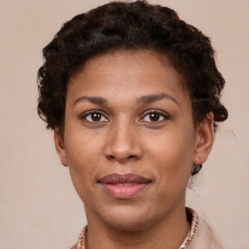 Joyful latino young-adult female with short  brown hair and brown eyes