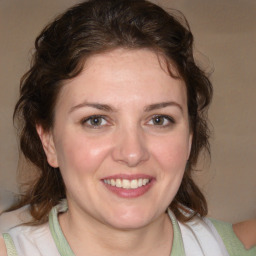 Joyful white young-adult female with medium  brown hair and blue eyes