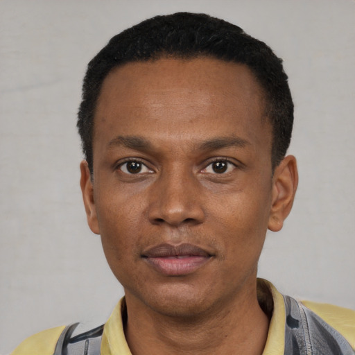 Neutral black young-adult male with short  black hair and brown eyes