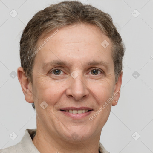 Joyful white adult male with short  brown hair and grey eyes