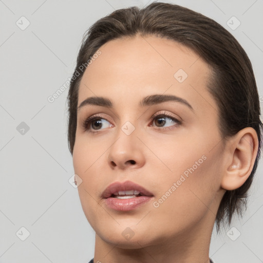 Neutral white young-adult female with medium  brown hair and brown eyes