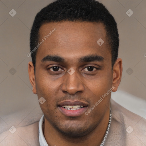 Joyful black young-adult male with short  black hair and brown eyes