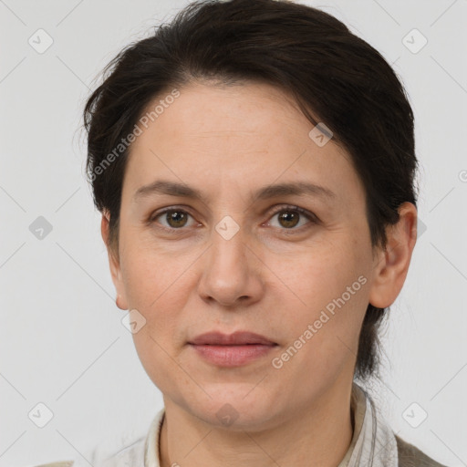 Joyful white adult female with short  brown hair and grey eyes