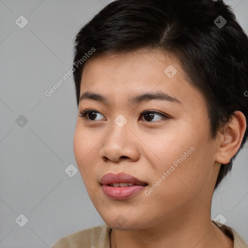 Joyful asian young-adult female with short  brown hair and brown eyes