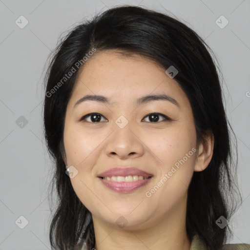 Joyful asian young-adult female with medium  black hair and brown eyes