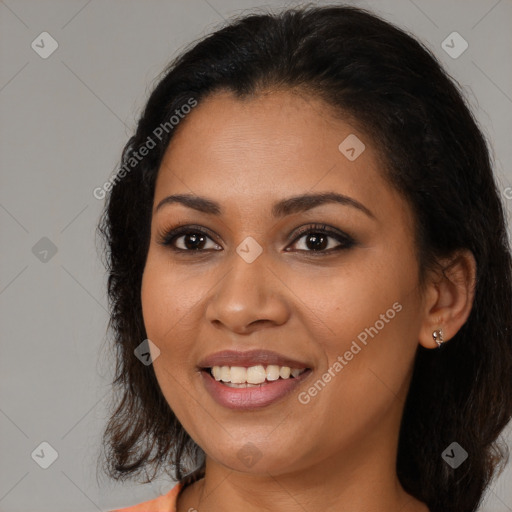 Joyful latino young-adult female with medium  brown hair and brown eyes