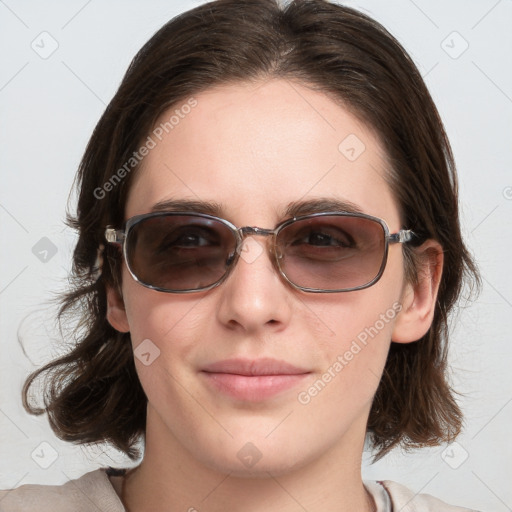 Joyful white young-adult female with medium  brown hair and blue eyes