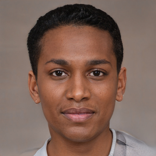 Joyful black young-adult male with short  black hair and brown eyes