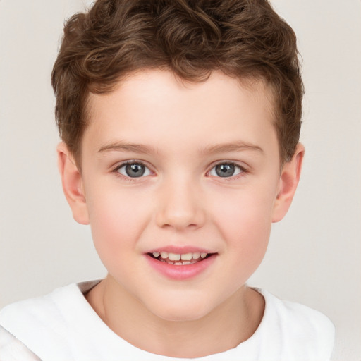 Joyful white child male with short  brown hair and brown eyes