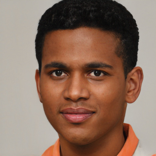 Joyful black young-adult male with short  brown hair and brown eyes