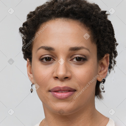 Joyful black young-adult female with short  brown hair and brown eyes