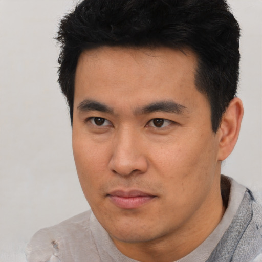 Neutral asian young-adult male with short  black hair and brown eyes