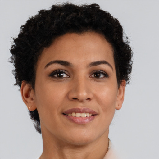 Joyful latino young-adult female with short  brown hair and brown eyes