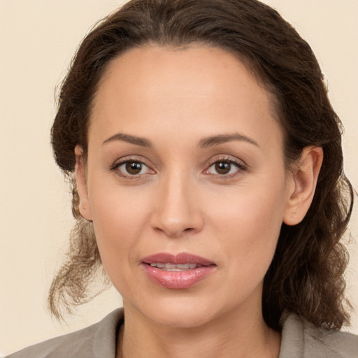 Joyful white young-adult female with medium  brown hair and brown eyes