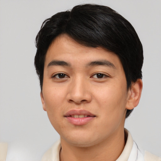 Joyful asian young-adult male with short  black hair and brown eyes